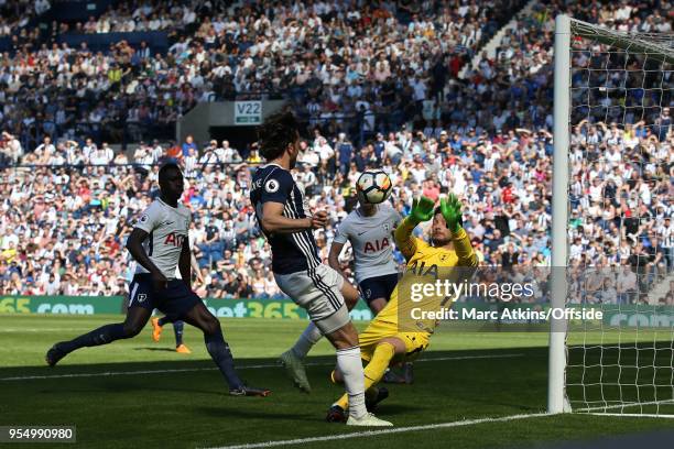 Tottenham Hotspur goalkeeper Hugo Lloris saves from Jay Rodriguez of West Bromwich Albion during the Premier League match between West Bromwich...