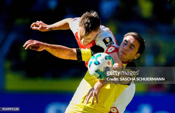 Dortmund's midfielder Mario Goetze and Mainz' Romanian midfielder Alexandru Maxim vie for the ball during the German first division Bundesliga...