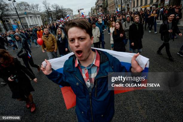 Opposition supporters attend an unauthorized anti-Putin rally called by opposition leader Alexei Navalny on May 5, 2018 in Saint Petersburg, two days...
