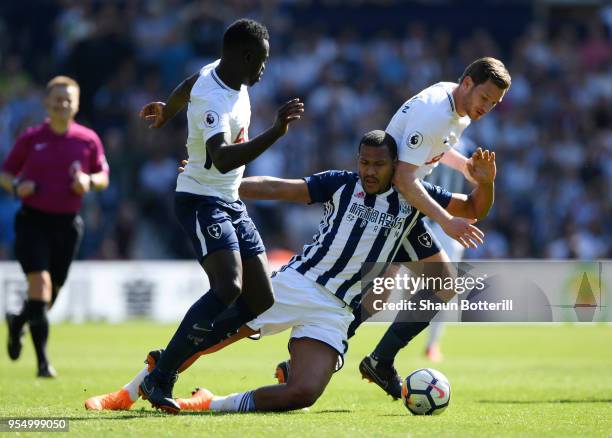 Davinson Sanchez and Jan Vertonghen of Tottenham Hotspur put pressure on Jose Salomon Rondon of West Bromwich Albion during the Premier League match...