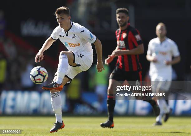 Swansea City's English midfielder Tom Carroll controls the ball during the English Premier League football match between Bournemouth and Swansea City...