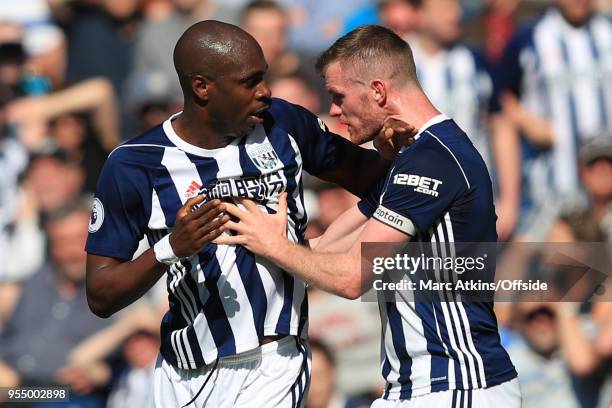 Chris Brunt of West Bromwich Albion tries to restrain team mate Allan Nyom after he clashes with Danny Rose of Tottenham Hotspur during the Premier...