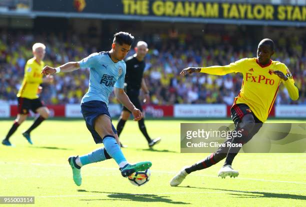 Ayoze Perez of Newcastle United and Abdoulaye Doucoure of Watford battle for the ball during the Premier League match between Watford and Newcastle...