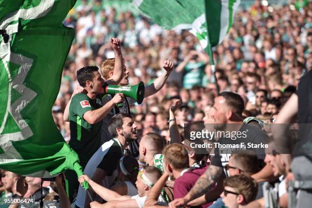 Zlatko Junuzovic of Bremen celebrates with the Bremen supporters during the Bundesliga match between SV Werder Bremen and Bayer 04 Leverkusen at...