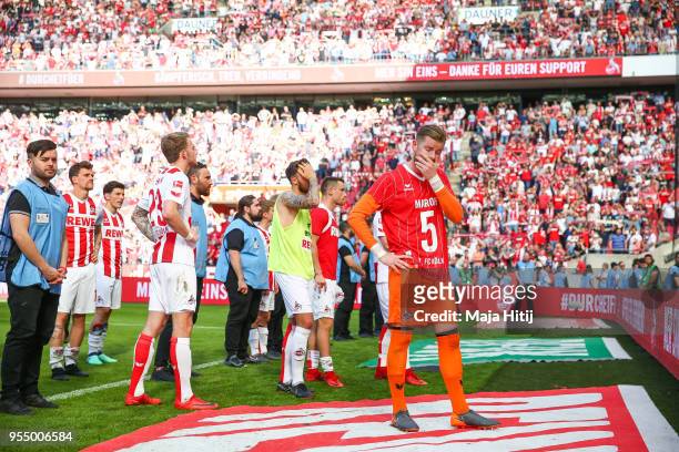 Timo Horn of 1.FC Koeln and players of 1.FC Koeln react after the Bundesliga match between 1. FC Koeln and FC Bayern Muenchen at RheinEnergieStadion...