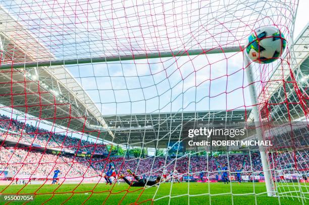 Wolfsburg's Belgian goalkeeper Koen Casteels fails to save the goal by Leipzig's French forward Jean-Kevin Augustin during the German first division...