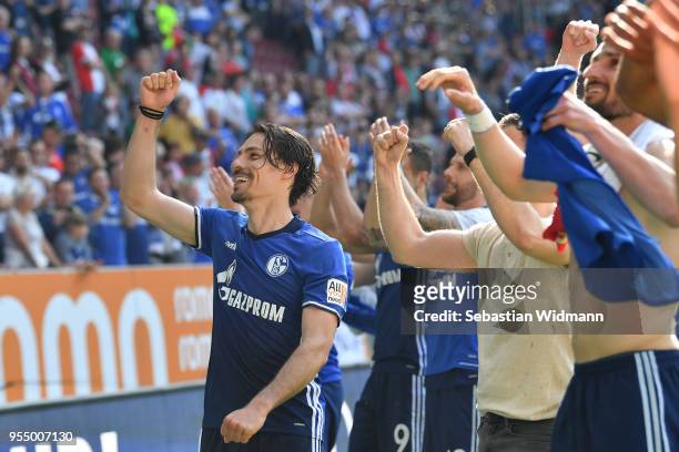 Benjamin Stambouli of Schalke celebrates with teammates after the Bundesliga match between FC Augsburg and FC Schalke 04 at WWK-Arena on May 5, 2018...