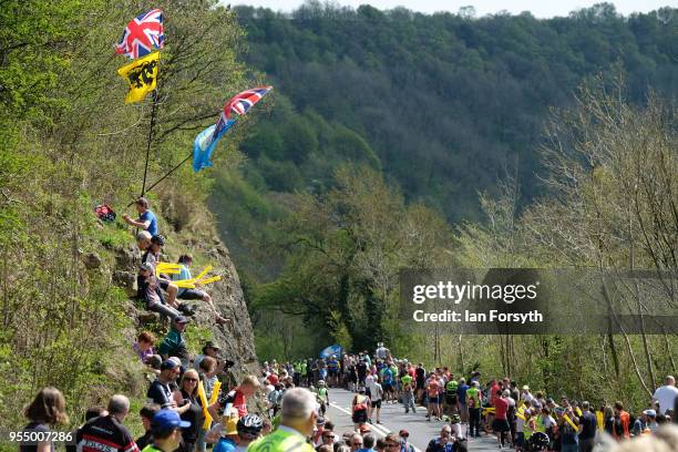 Spectators gather as they wait for riders to climb up the iconic Sutton Bank during the third stage of the Tour de Yorkshire cycling race on May 5,...