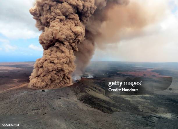 In this handout photo provided by the U.S. Geological Survey, a column of robust, reddish-brown ash plume occurred after a magnitude 6.9 South Flank...