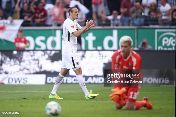 Alexander Meier of Frankfurt applauds and celebrates after he scored a goal to make it 3:0 during the Bundesliga match between Eintracht Frankfurt...
