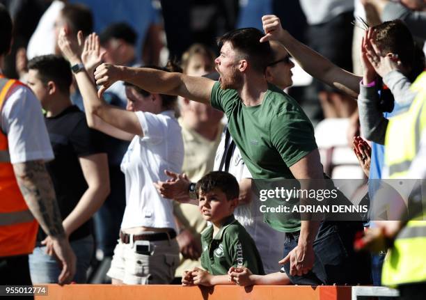 Swansea City fans react at the final whistle at the English Premier League football match between Bournemouth and Swansea City at the Vitality...