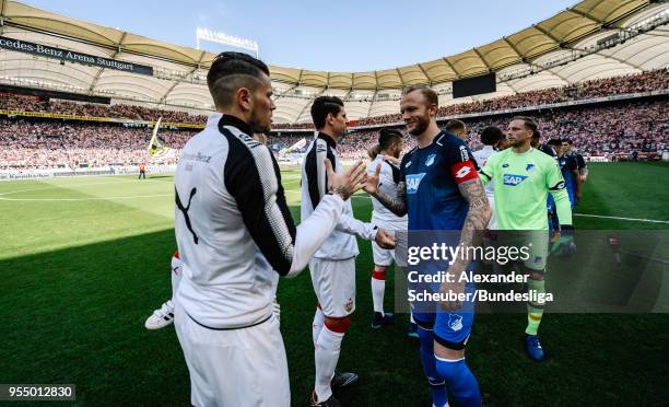 Daniel Ginczek of Stuttgart and Kevin Vogt of Hoffenheim shake hands during the Bundesliga match between VfB Stuttgart and TSG 1899 Hoffenheim at...