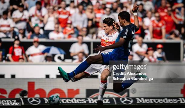 Kevin Akpoguma of Hoffenheim challenges Mario Gomez of Stuttgart during the Bundesliga match between VfB Stuttgart and TSG 1899 Hoffenheim at...