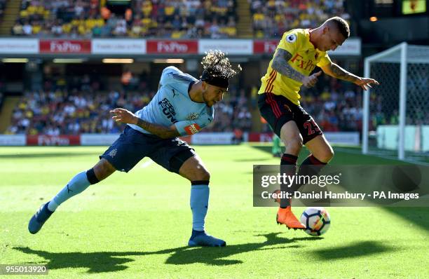 Newcastle United's DeAndre Yedlin and Watford's Jose Holebas battle for the ball during the Premier League match at Vicarage Road, Watford.