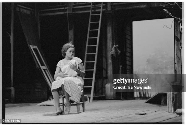Bess holding clara's baby, Bess cares for Clara's baby while she searches for her husband in a hurricane in the opera Porgy and Bess Glyndebourne,...