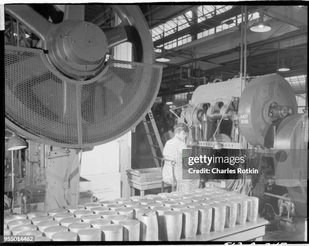 Brass mill, Coffee pot bowls being manufactured in a brass mill at the ammunition division of East Alton Works. Location: East Alton, Illinois, USA,...