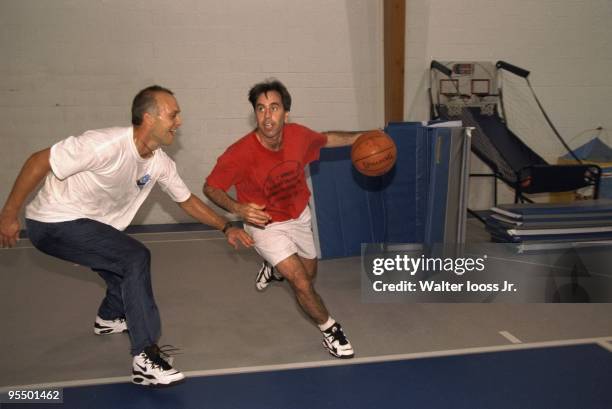 Senior writer Tim Kurkjian playing basketball with Baltimore Orioles Cal Ripken Jr. At Ripken's home gym. Reisterstown, MD 7/25/1995 CREDIT: Walter...