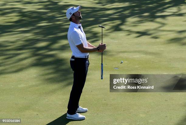 Scott Jamieson of Scotland reacts after his putt shot on the fifth green during Day One of the GolfSixes at The Centurion Club on May 5, 2018 in St...