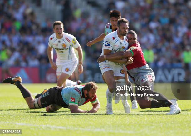Phil Dollman of Exeter Chiefs tackled by Kyle Sinckler of Harlequins during the Aviva Premiership match between Harlequins and Exeter Chiefs at...
