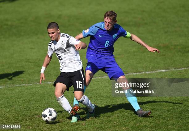 Can Bozdogan of Germany and Daishawn Redan of Netherlands in action during the UEFA European Under-17 Championship match between Germany and...