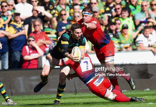 George North of Northampton Saints is tackled by Sam Lewis and GJ van Velze of Worcester Warriors during the Aviva Premiership match between...