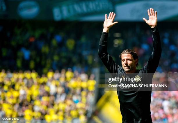 Dortmund's goalkeeper Roman Weidenfeller bids farewell to supporters, as he leaves the club, at the end of the German first division Bundesliga...