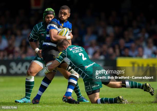 Bath Rugby's Taulupe Faletau is tackled by London Irish's Dave Porecki during the Aviva Premiership match between Bath Rugby and London Irish at...