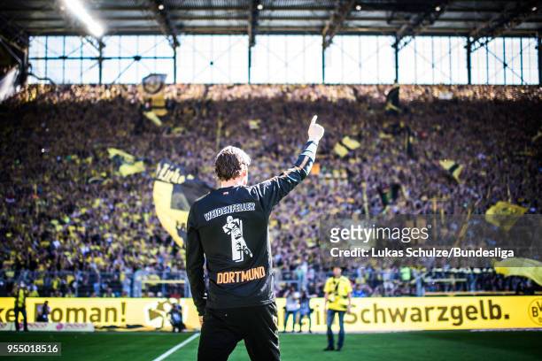 Goalkeeper Roman Weidenfeller of Dortmund celebrates his last home match with fans of the Suedtribuene prior to the Bundesliga match between Borussia...