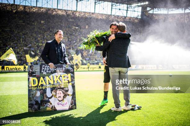Goalkeeper Roman Weidenfeller of Dortmund gets presents for his last home match for Borussia Dortmund prior to the Bundesliga match between Borussia...