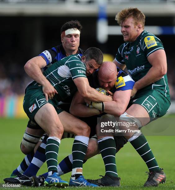 Matt Garvey of Bath Rugby is tackled by Fergus Mulchrone and Josh McNally of ondon Irish during the Aviva Premiership match between Bath Rugby and...
