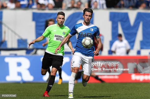 Tom Baumgart of Chemnitzer FC and Marius Sowislo of 1. FC Magdeburg compete during the 3. Liga match between 1. FC Magdeburg and Chemnitzer FC at...