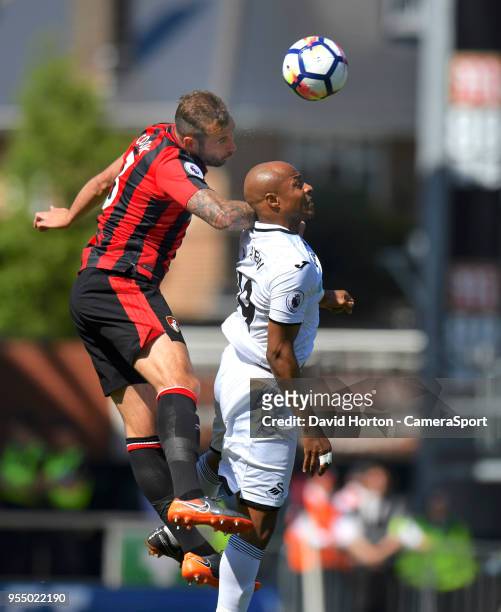 Swansea City's Andre Ayew battles with Bournemouth's Steve Cook during the Premier League match between AFC Bournemouth and Swansea City at Vitality...