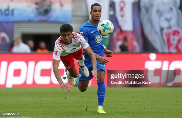 Fernandes da Silva of Leipzig battles for the ball with Daniel Didavi of Wolfsburg during the Bundesliga match between RB Leipzig and VfL Wolfsburg...