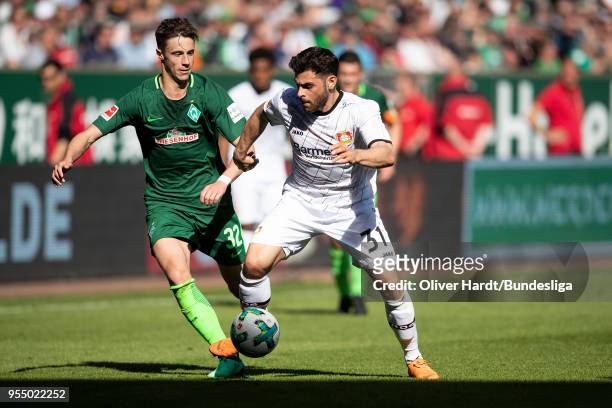 Marco Friedl of Bremen and Kevin Volland of Leverkusen compete for the ball during the Bundesliga match between SV Werder Bremen and Bayer 04...