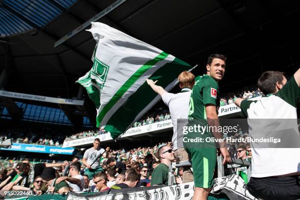 Zlatko Junuzovic of Bremen celebrates with fans after the Bundesliga match between SV Werder Bremen and Bayer 04 Leverkusen at Weserstadion on May 5,...