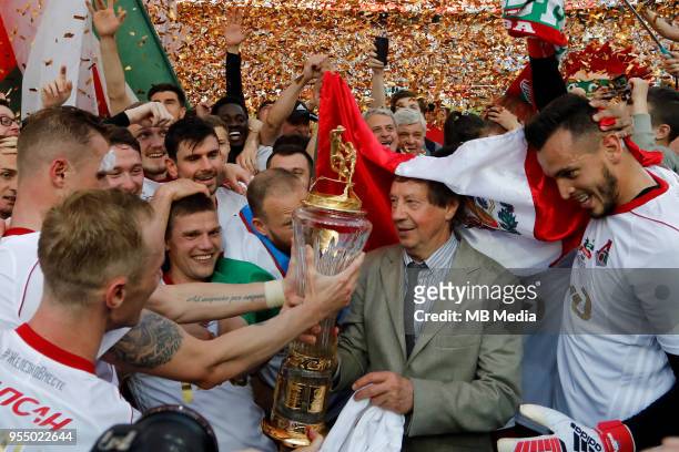 Lokomotiv Moscow head coach Yuri Semin and his players celebrate with the trophy after the Russian Football League match between FC Lokomotiv Moscow...