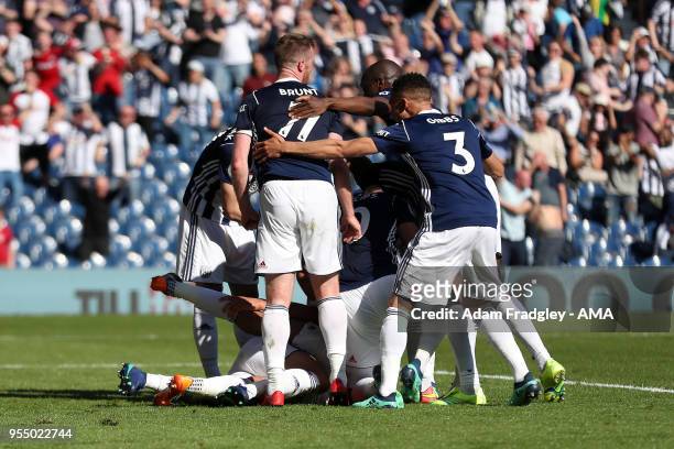 West Bromwich Albion players mob Jake Livermore of West Bromwich Albion after he scored a last minute goal to make it 1-0 during the Premier League...