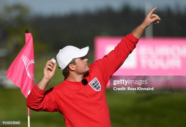 Eddie Pepperell of England throws ball into the crowd on the last hole during Day One of the GolfSixes at The Centurion Club on May 5, 2018 in St...