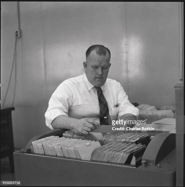 Office worker at a texaco oil refinery, circa 1957, Illinois, USA.