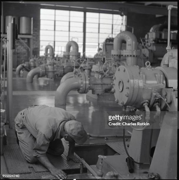 Worker in a texaco refinery, circa 1957, Illinois, USA.