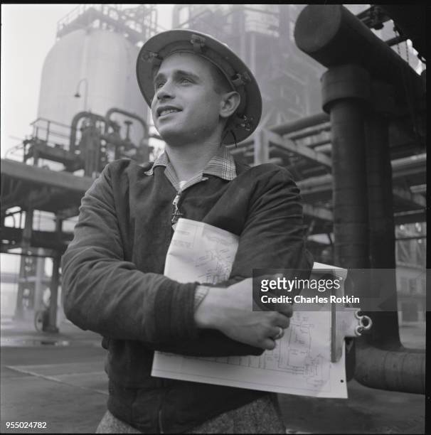 Worker at a texaco refinery, circa 1957, Illinois, USA.
