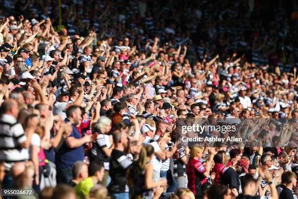 Fans of Hull FC cheer as their team take the field during the Betfred Super League match between Hull FC and Castleford Tigers at KCOM Stadium on May...