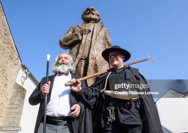 Heinrich Laufer dressed as philosopher and revolutionary Karl Marx and nightwatchman Alf Keilen as 'Jacobus Fischer the Younger' pose for pictures in...