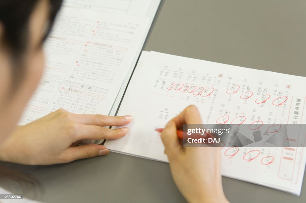 Operators Checking Papers Female Teacher Checking Papers High-Res Stock Photo - Getty Images