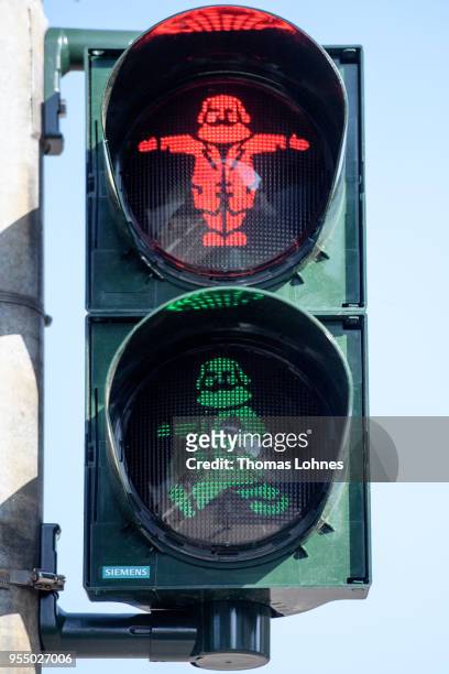 Pedestrian traffic light with the German philosopher and revolutionary Karl Marx switches from red to green on the 200th anniversary of the birth of...