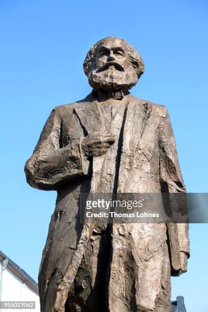 The sculpture of German philosopher and revolutionary Karl Marx pictured on the 200th anniversary of the birth of Karl Marx on May 5, 2018 in Trier,...