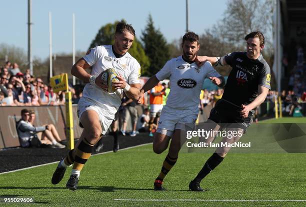 Josh Bassett of Wasps runs through to scores his team's fourth try during the Aviva Premiership match between Newcastle Falcons and Wasps at Kingston...