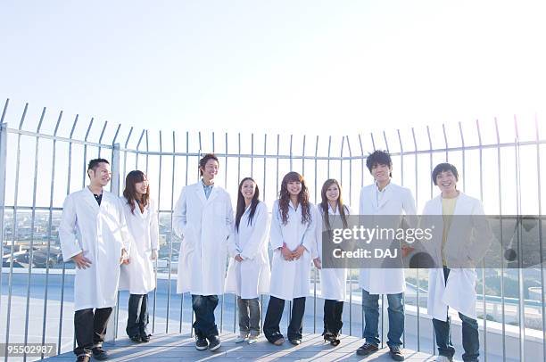 college students in white coat - public building ストックフォトと画像