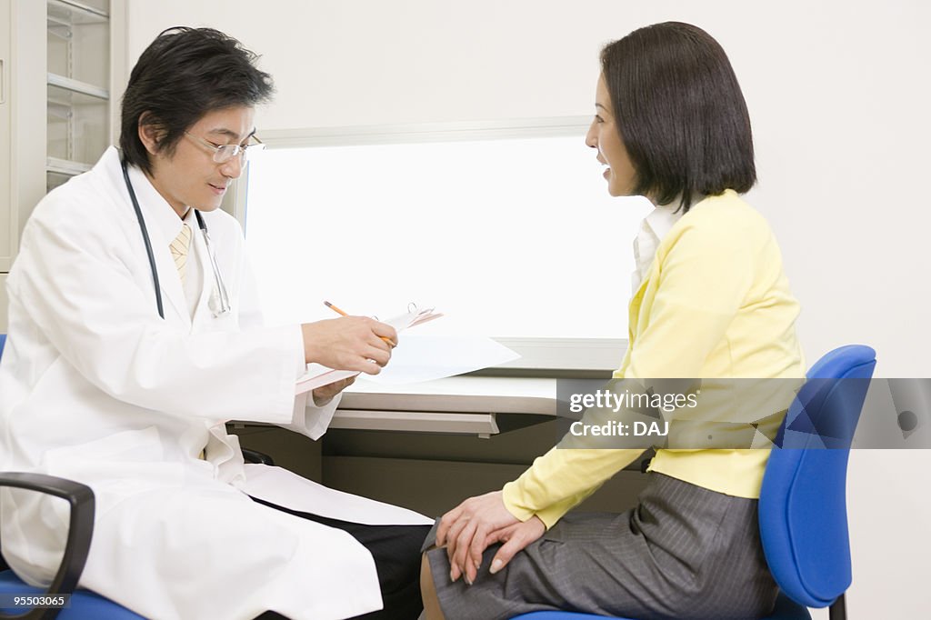 Doctor taking to a patient