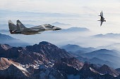 Mig-29 Fighter Jets in Flight above the mountains